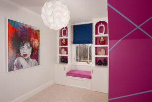pink and white built-in bookcase