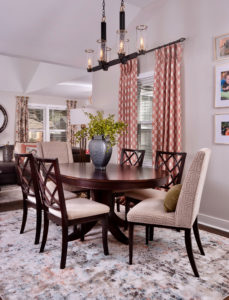 neutral dining room with pink curtains