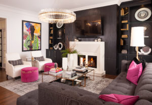 living room with pink pillows and black wall