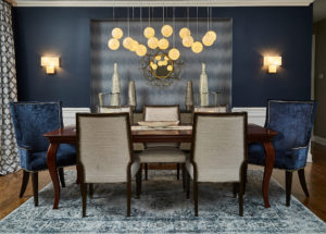 Blue velvet dining room chairs and blue accent wall