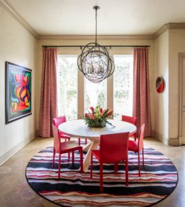dining room with pink chairs