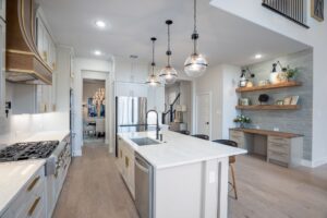 white kitchen with overhead lighting 